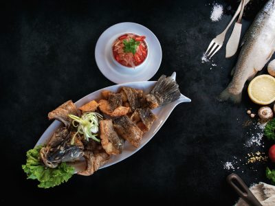 Top view of fish with vegetables and spices. Cooking or healthy concept, with copy space, top view